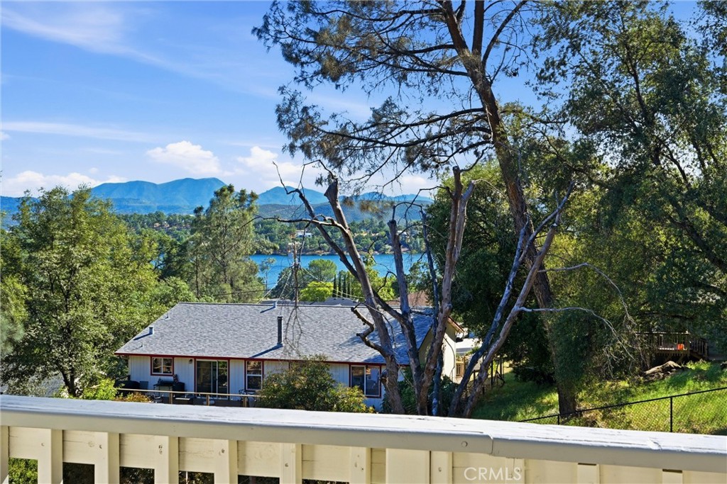 18685 Oak Grove Road Hidden Valley Lake, CA 95467 - Photo 16 of 52 a house view with a garden and trees