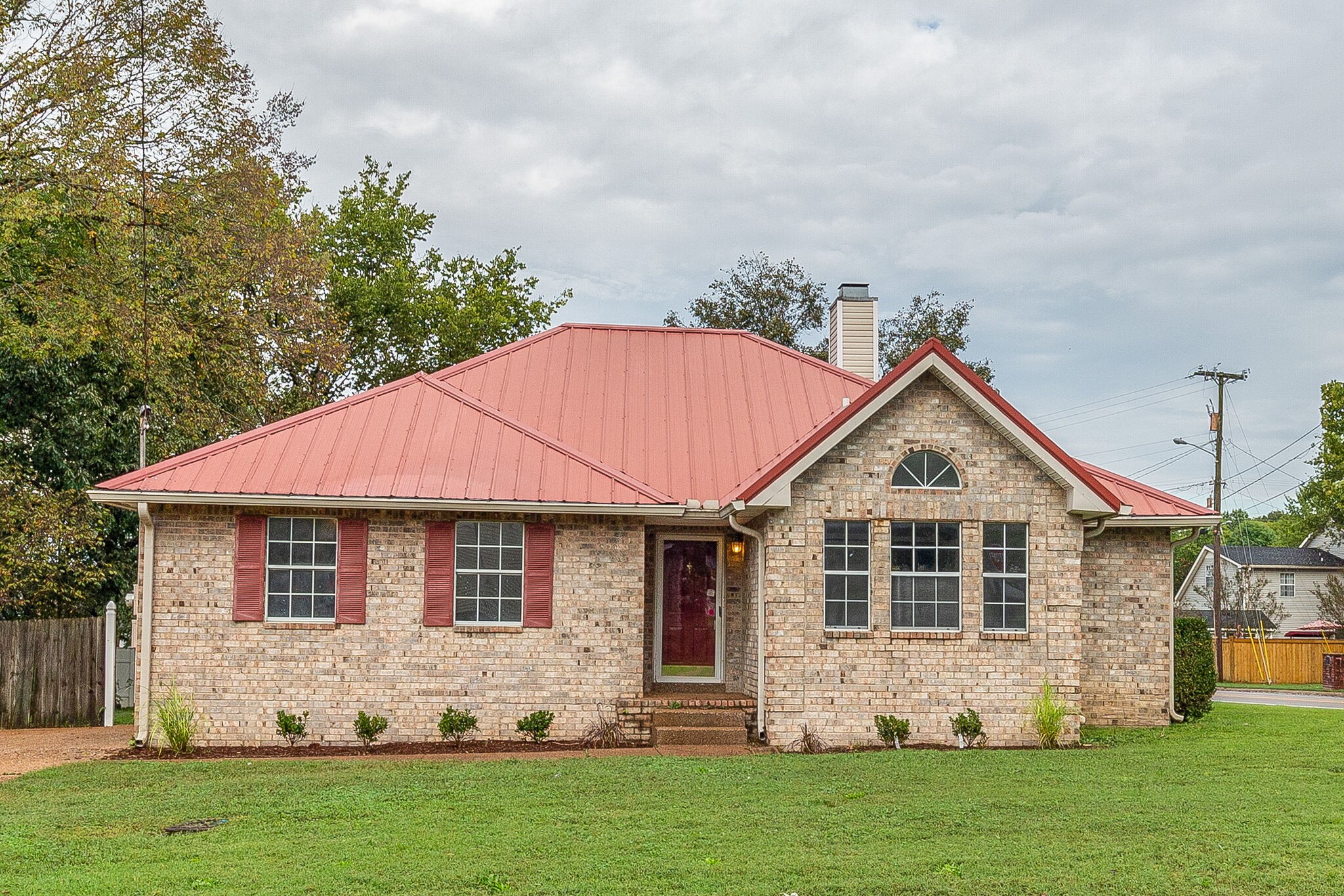 3218 Country Hill Road Antioch, TN 37013 - Photo 1 of 22 a front view of a house with a yard
