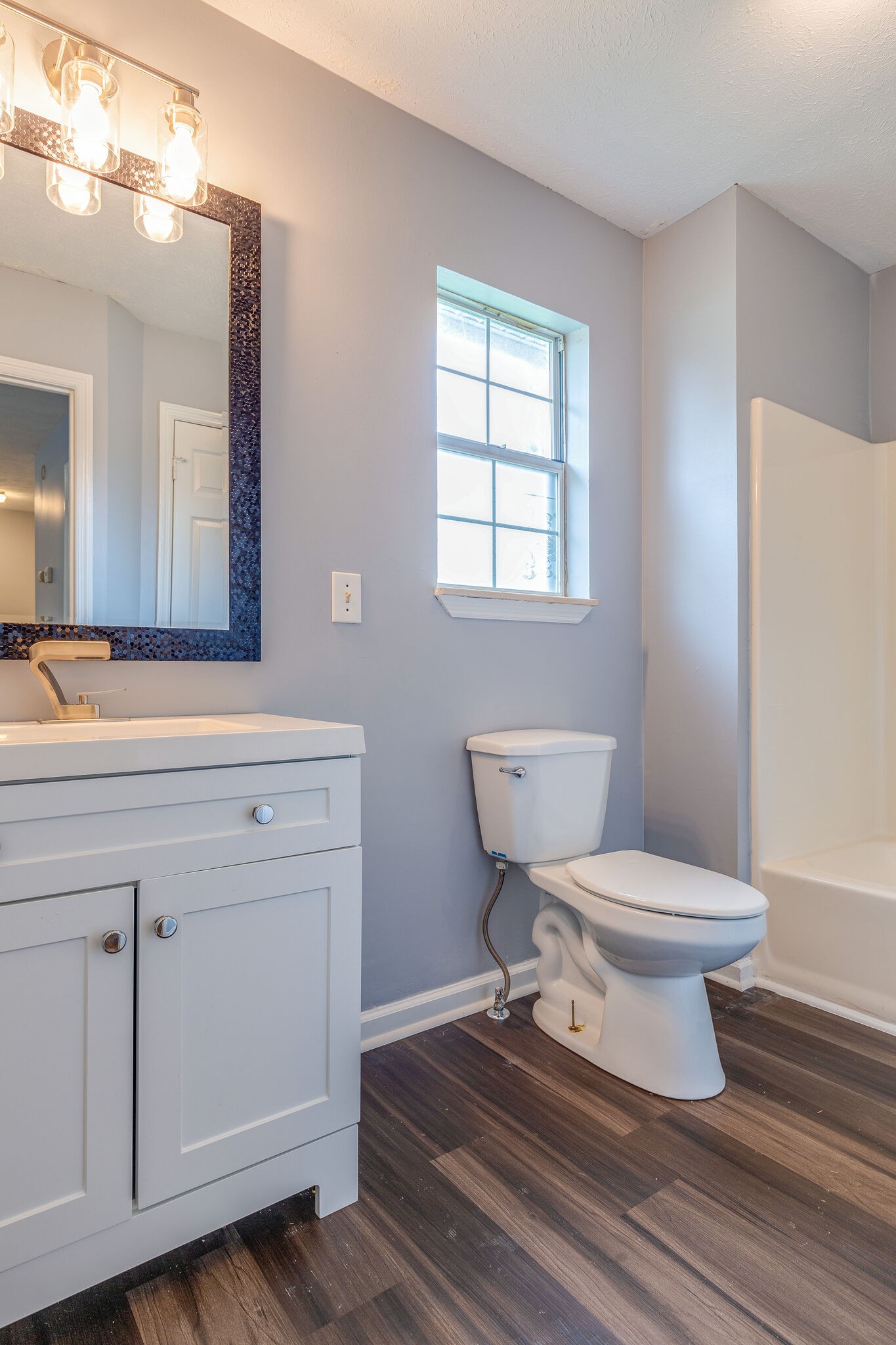 3218 Country Hill Road Antioch, TN 37013 - Photo 14 of 22 a bathroom with a toilet sink and mirror