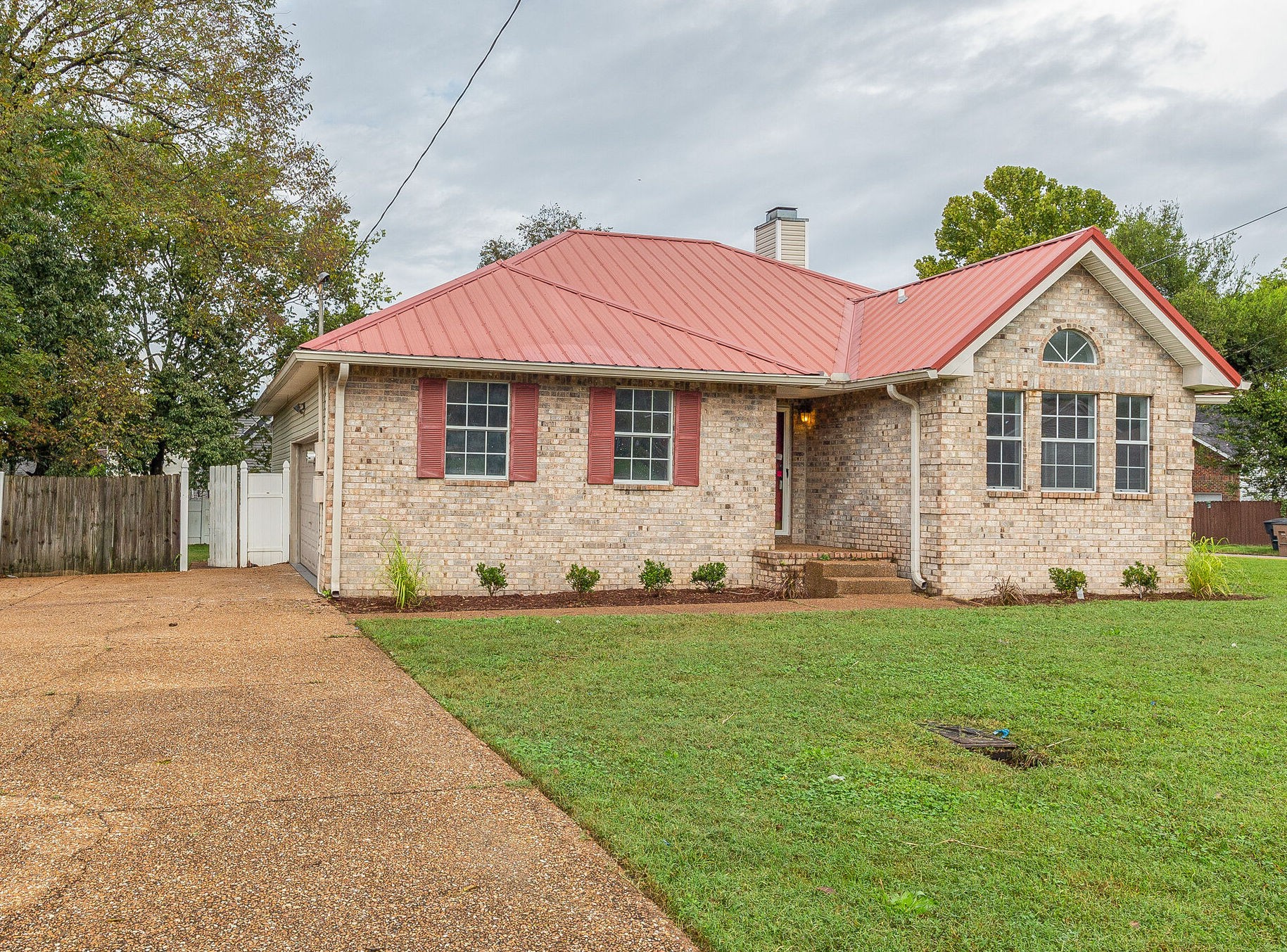 3218 Country Hill Road Antioch, TN 37013 - Photo 3 of 22 a front view of a house with a garden