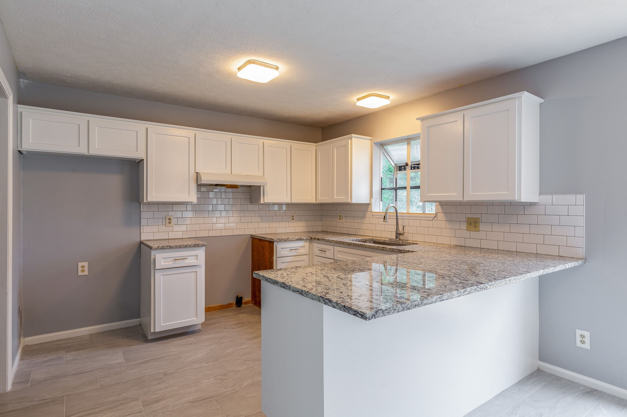 3218 Country Hill Road Antioch, TN 37013 - Photo 7 of 22 a kitchen with stainless steel appliances granite countertop a sink stove and refrigerator