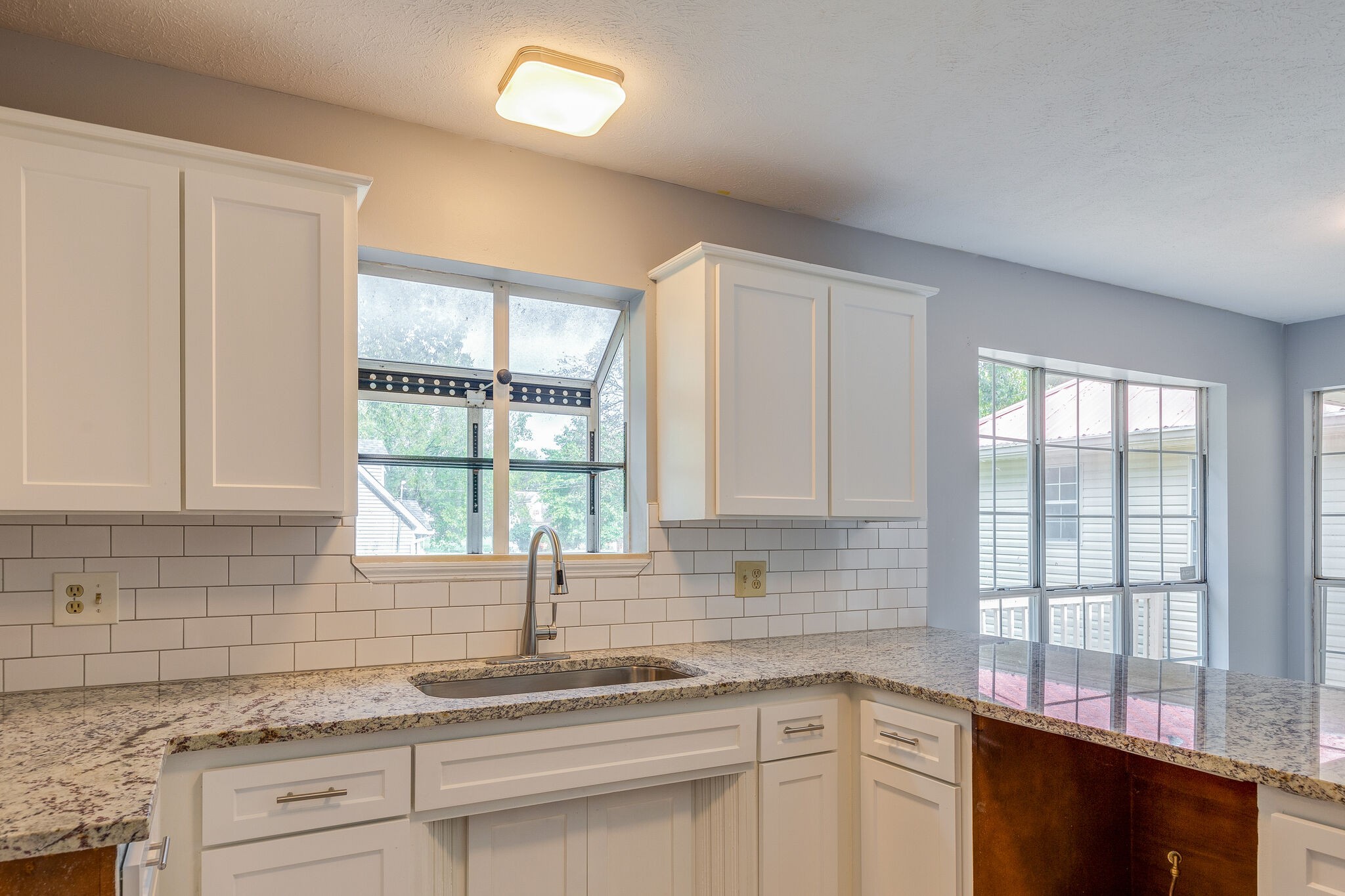 3218 Country Hill Road Antioch, TN 37013 - Photo 8 of 22 a kitchen with stainless steel appliances granite countertop a sink a stove and window