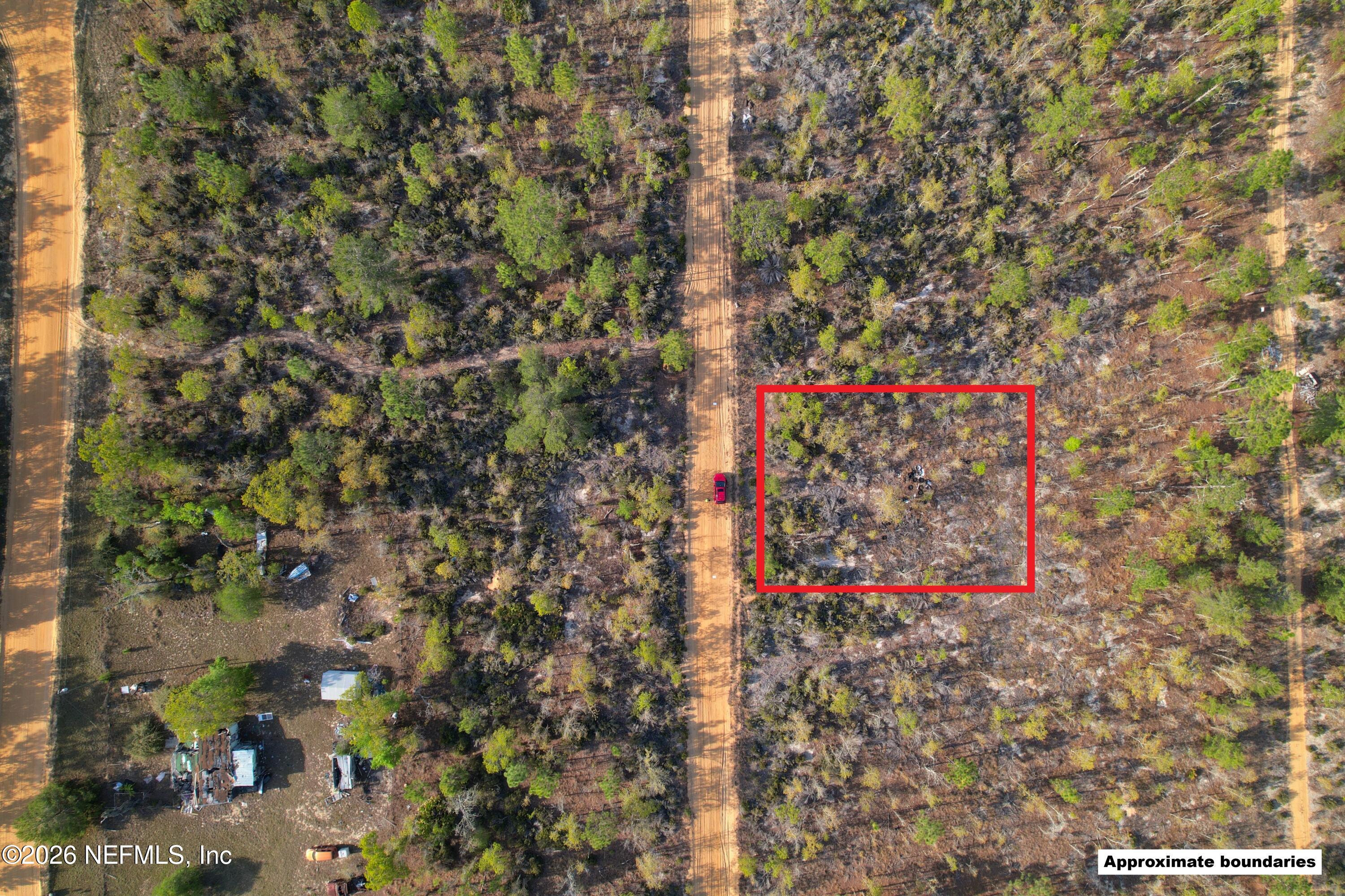 a street sign that is sitting on a brick wall