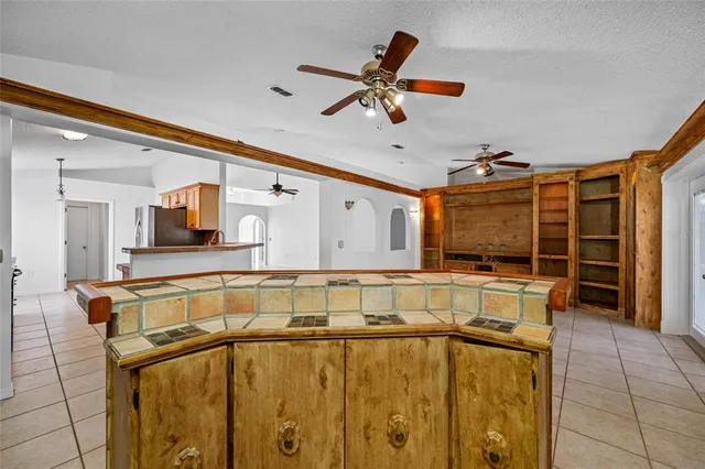 a view of a kitchen with a sink and furniture