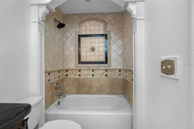 a bath tub sitting in a bathroom next to a window
