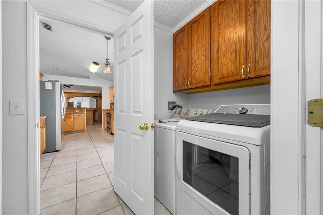 a view of a hallway with washer and dryer