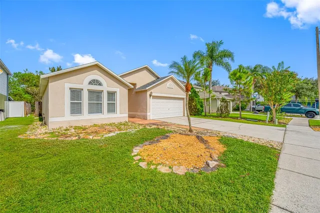 a view of an house with swimming pool yard and outdoor seating