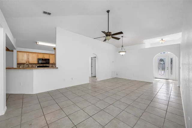 a view of a kitchen with a sink and cabinets