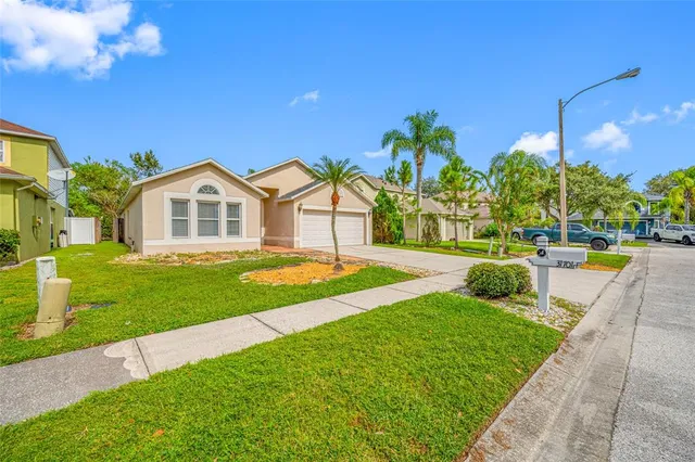 a front view of a house with a garden and entryway