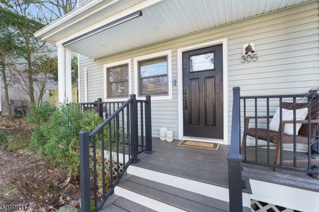 a view of a brick house with large windows