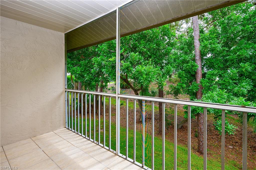 2370 Naples Trace Circle, Unit 7 Naples, FL 34109 - Photo 2 of 23 a view of a balcony