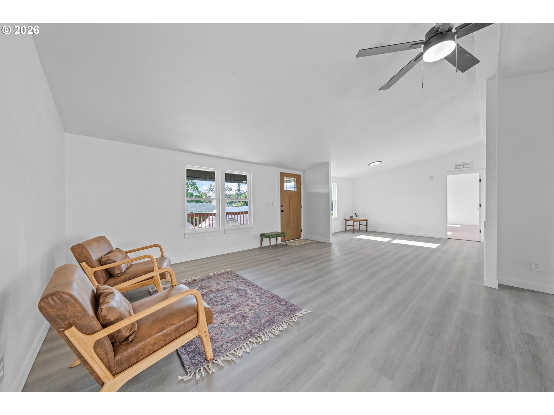 70 Darrell Avenue Winston, OR 97496 - Photo 6 of 39 a view of workspace with wooden floor ceiling fan and windows