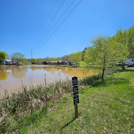 a view of a lake with houses in the back