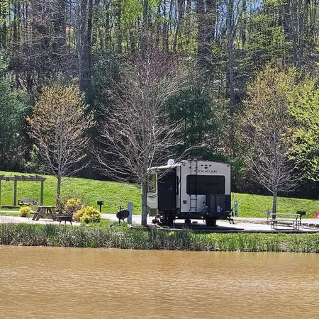 a front view of a house with garden and sitting area