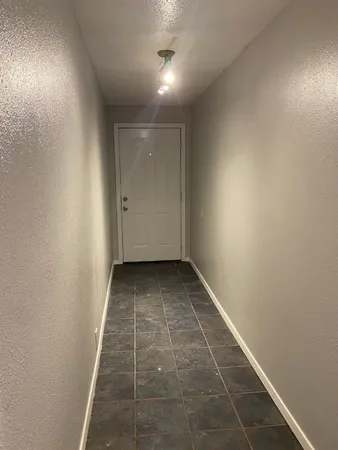 a view of hallway with a window