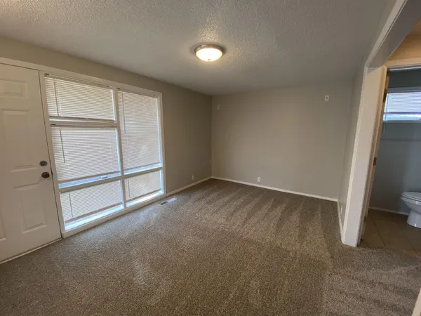 an empty room with sliding door