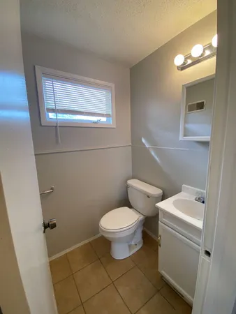 a bathroom with a toilet and a sink