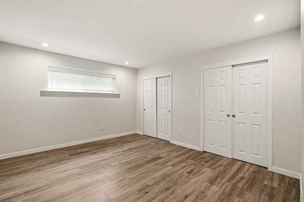7354 Walling Lane Dallas, TX 75231 - Photo 13 of 28 a view of an empty room with wooden floor