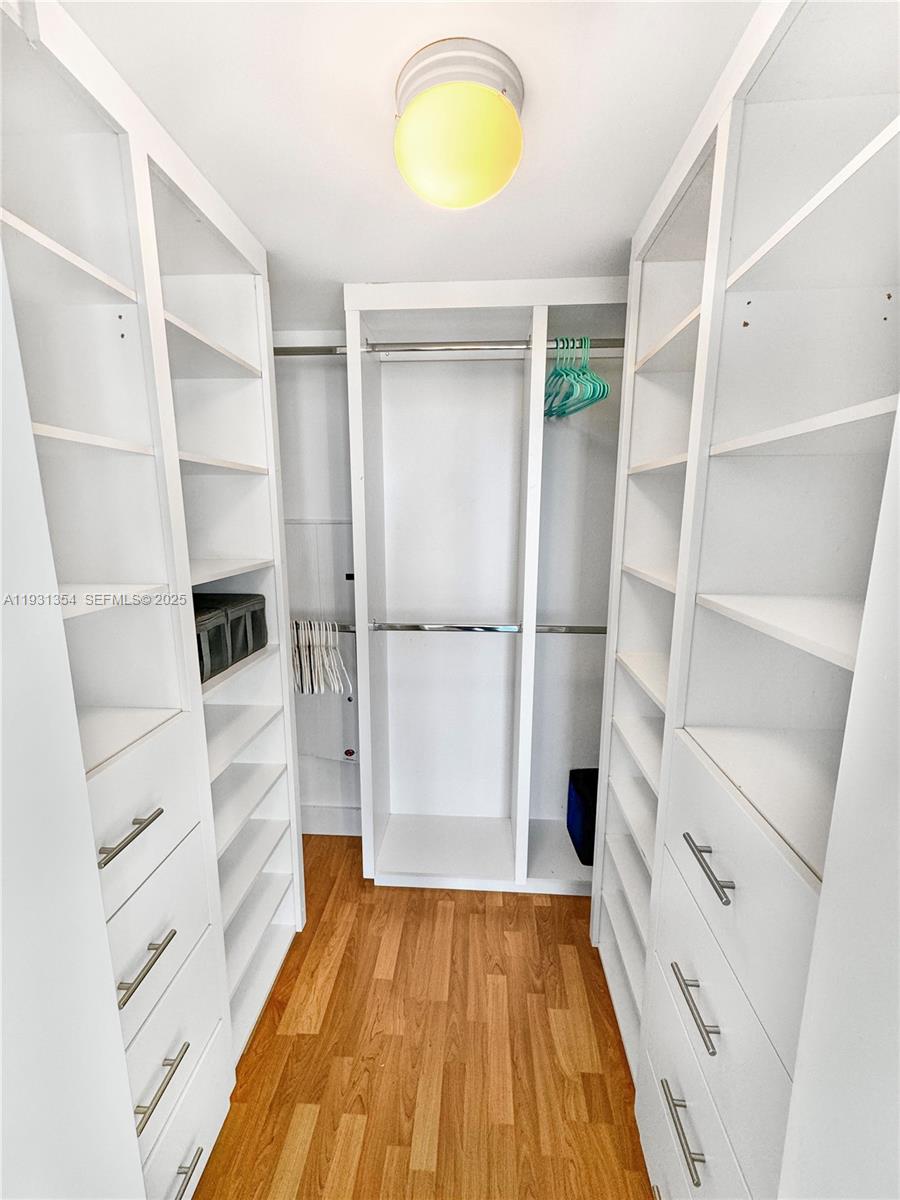 185 Southwest 7th Street, Unit 2701 Miami, FL 33130 - Photo 15 of 24 a view of walk in closet with empty racks