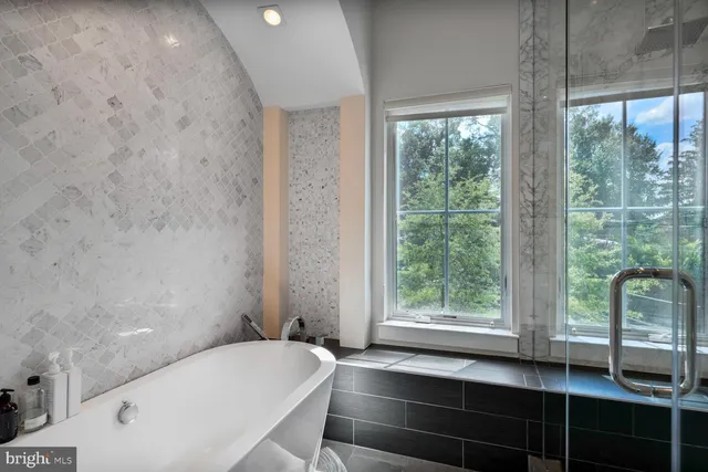 a bathroom with a double vanity sink mirror and