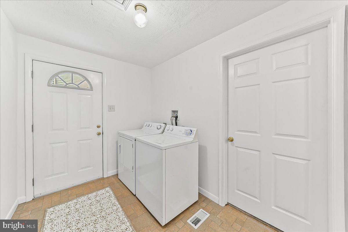 929 Crystle Road Aston, PA 19014 - Photo 13 of 18 a utility room with a sink dryer and washer
