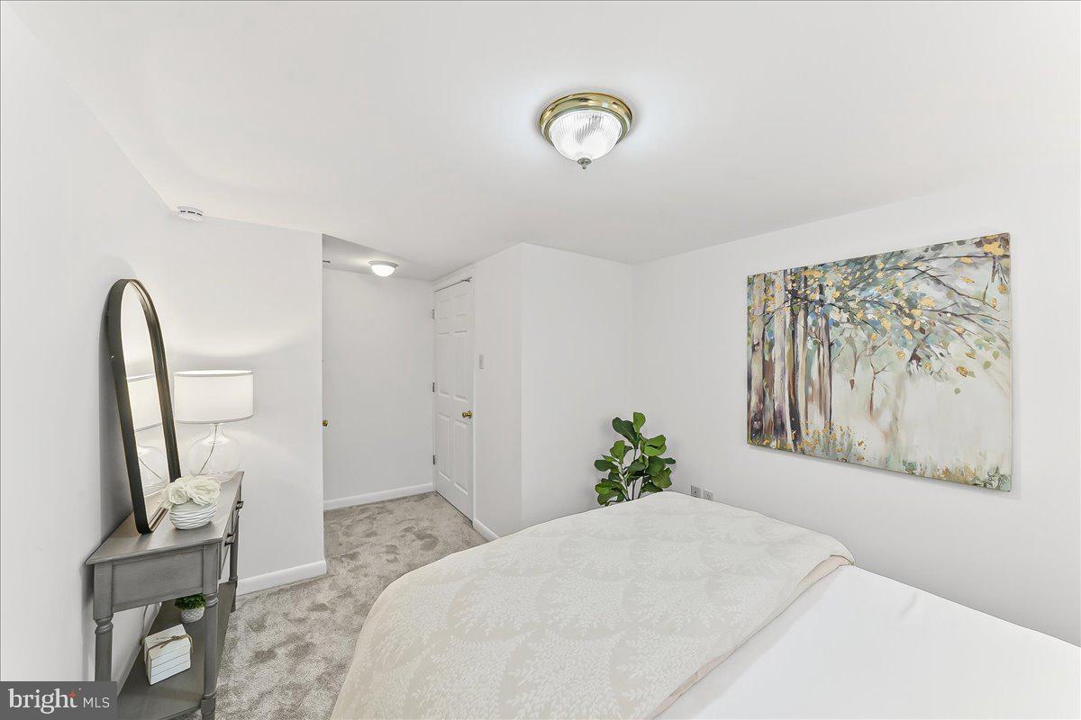 929 Crystle Road Aston, PA 19014 - Photo 15 of 18 a bedroom with a bed and a flat screen tv