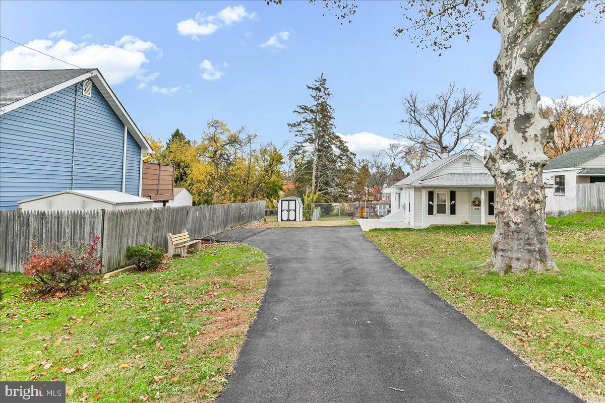 929 Crystle Road Aston, PA 19014 - Photo 2 of 18 a view of house with garden