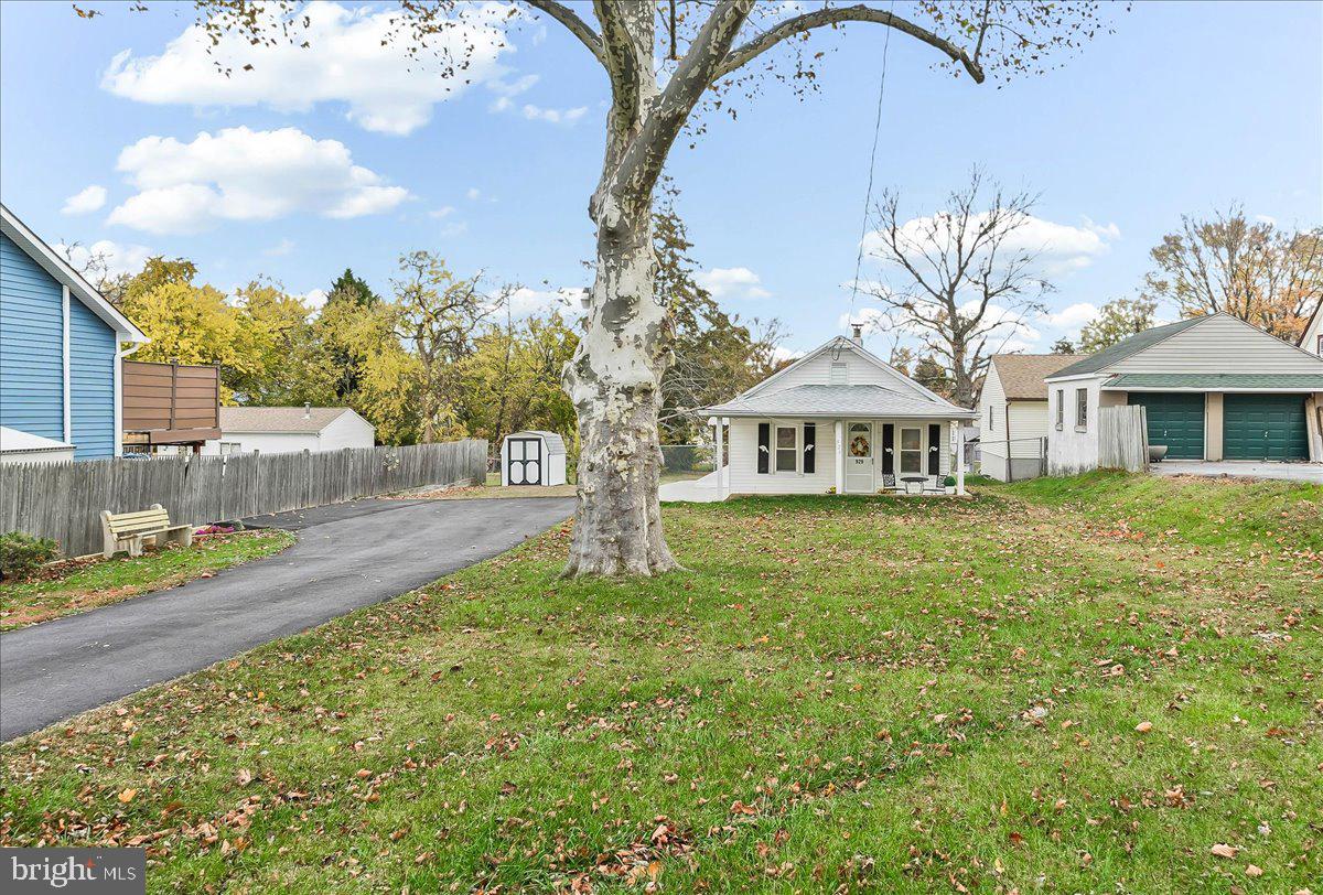 929 Crystle Road Aston, PA 19014 - Photo 3 of 18 a front view of a house with garden
