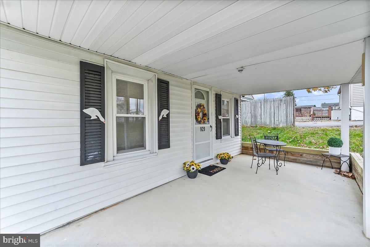 929 Crystle Road Aston, PA 19014 - Photo 4 of 18 a balcony with furniture and a gate