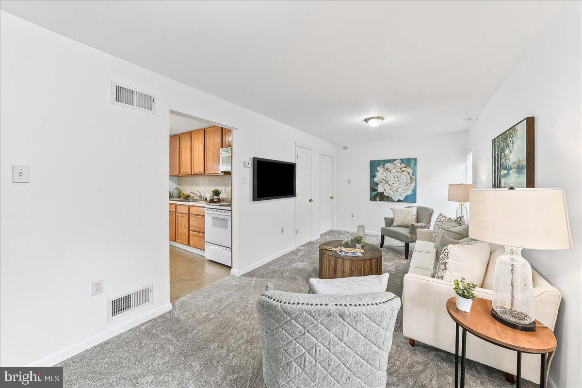 929 Crystle Road Aston, PA 19014 - Photo 5 of 18 a living room with furniture and a flat screen tv