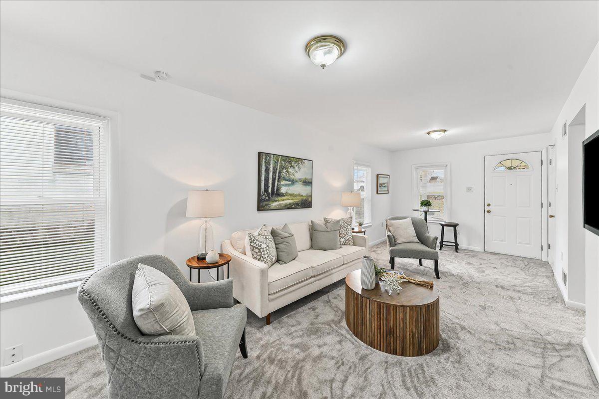 929 Crystle Road Aston, PA 19014 - Photo 7 of 18 a living room with furniture a rug and a window