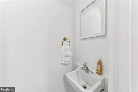a bathroom with a sink and mirror