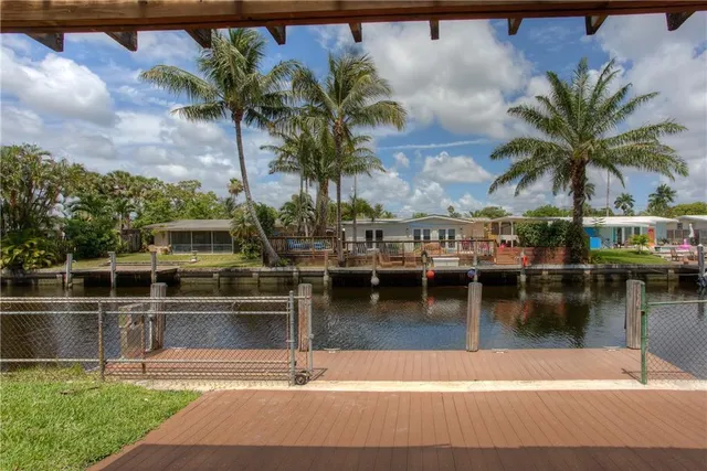 a view of a swimming pool with a table and chairs