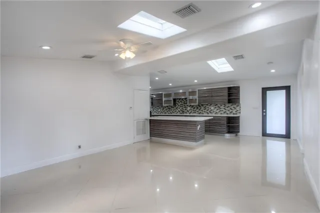 a view of workspace with furniture and window