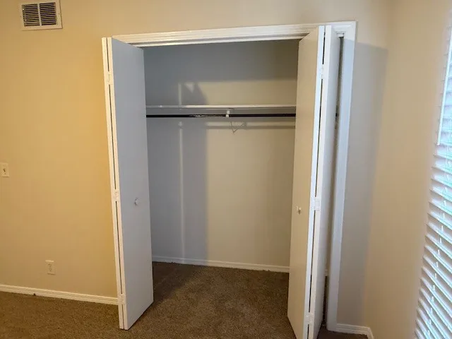a view of walk in closet with window