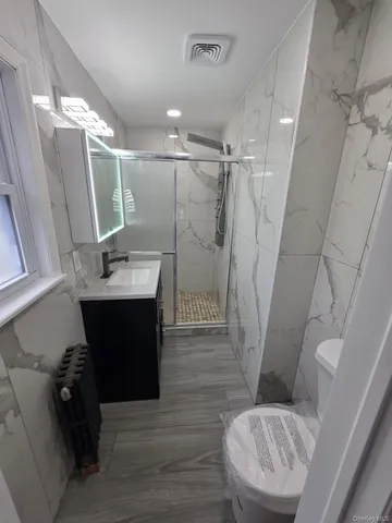a bathroom with a sink and toilet