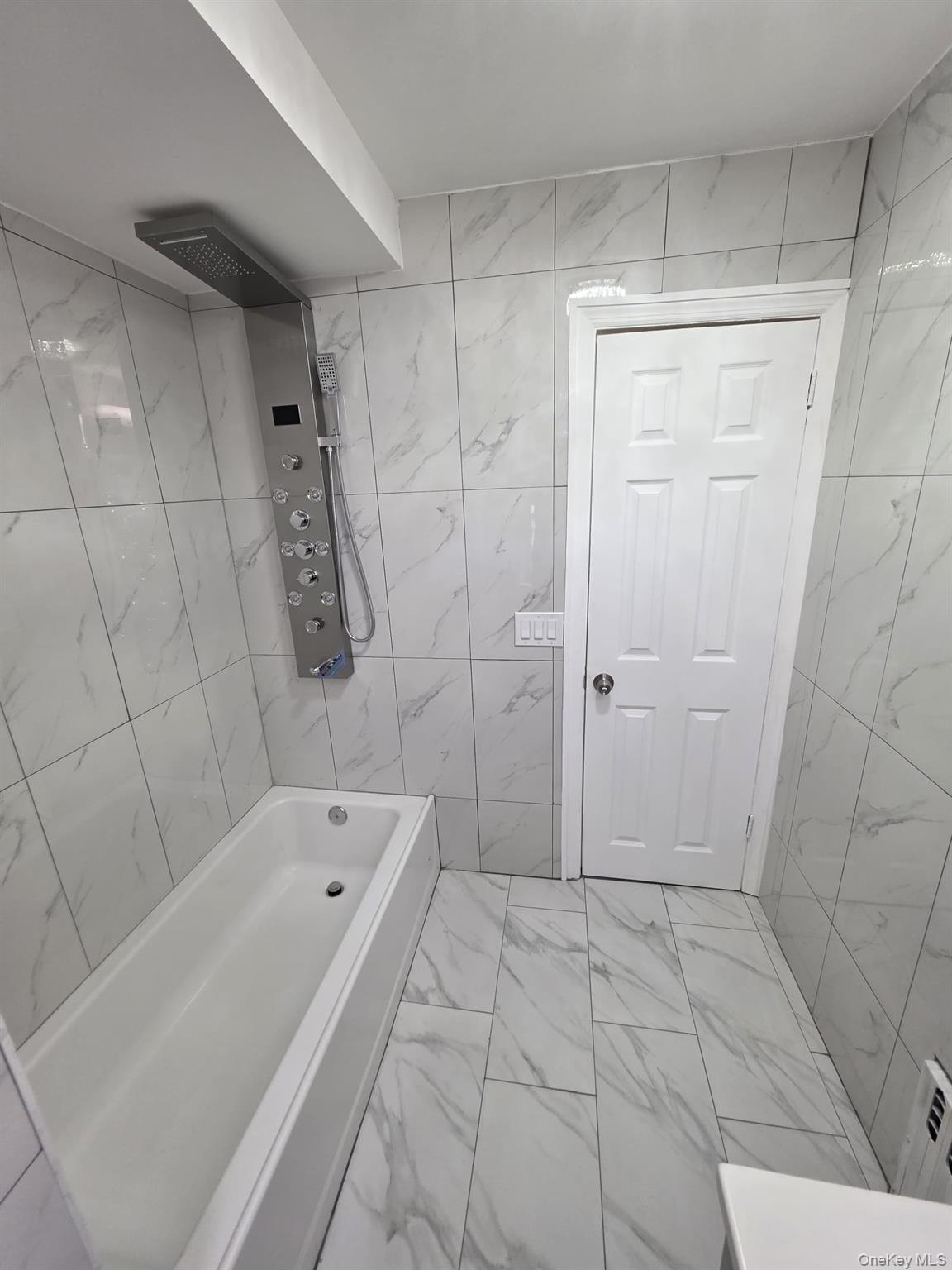 109-73 200th Street Queens, NY 11412 - Photo 4 of 12 a bathroom with a bathtub and shower