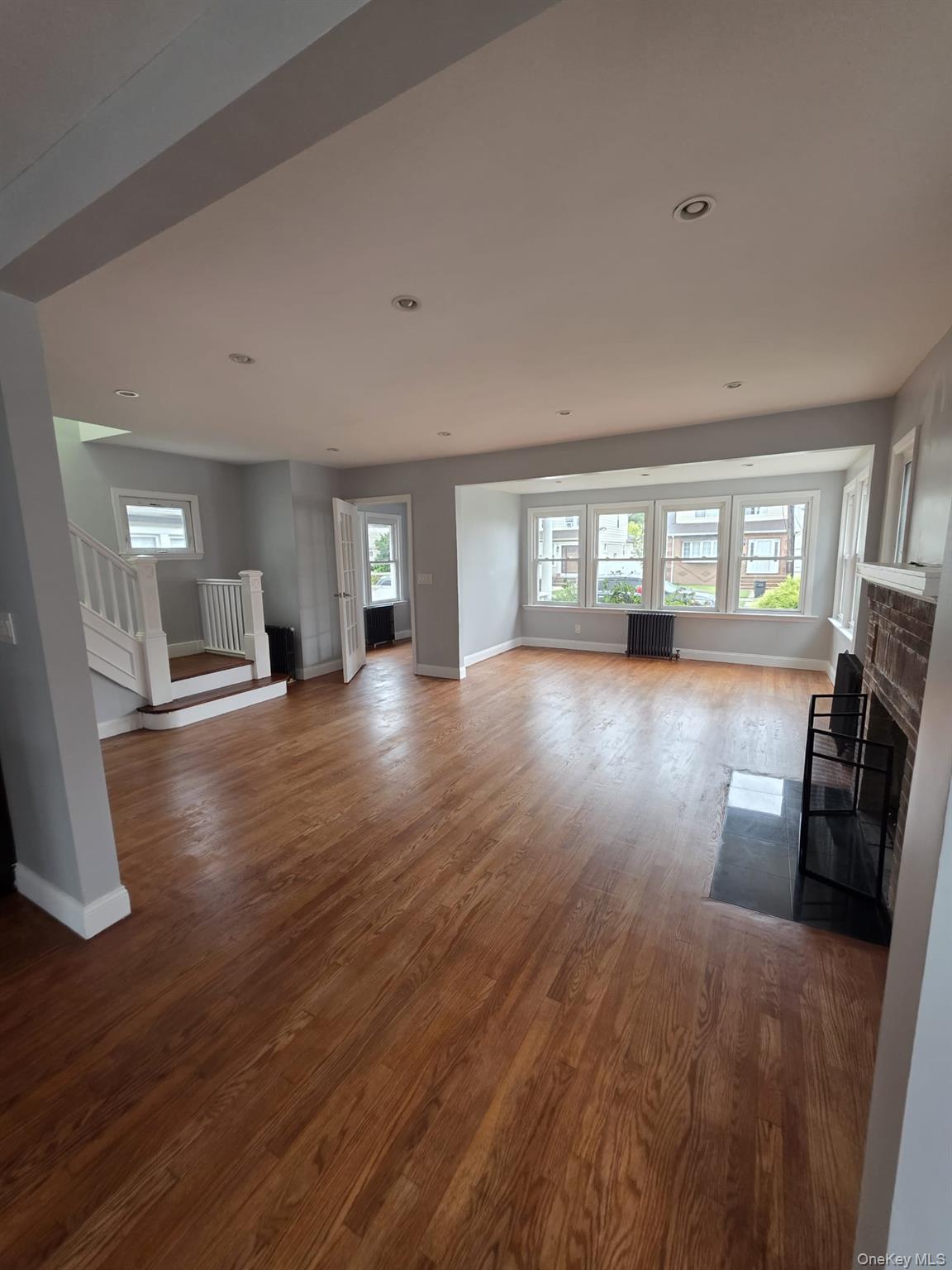 109-73 200th Street Queens, NY 11412 - Photo 8 of 12 a view of a livingroom with furniture hardwood floor and a window