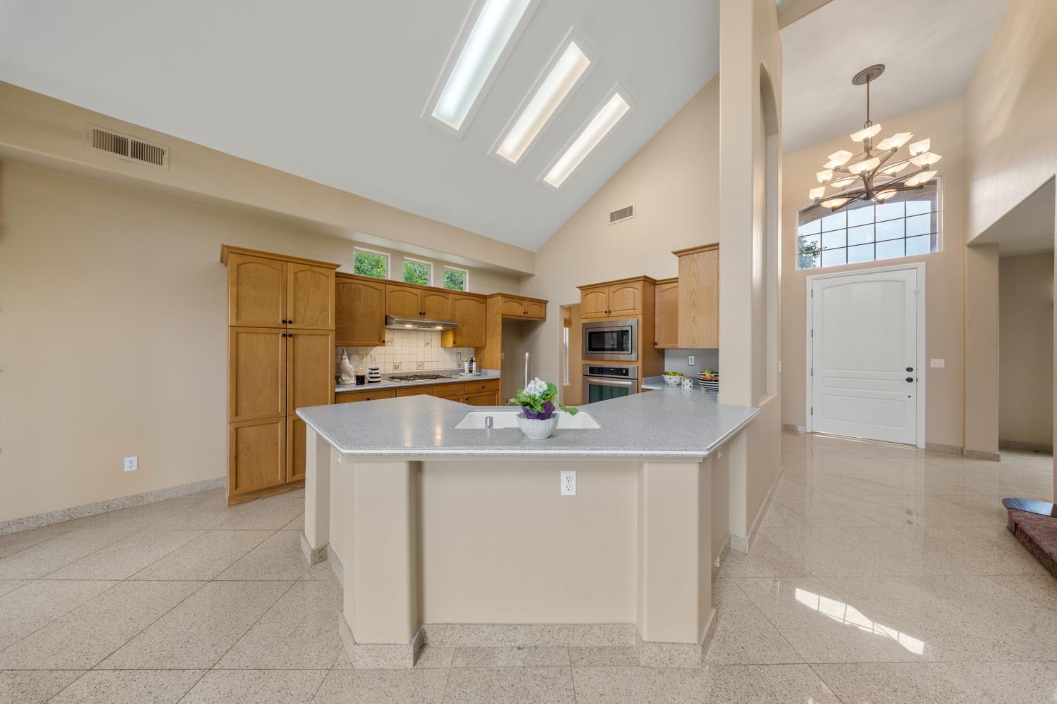 4601 Vía Altura Modesto, CA 95357 - Photo 16 of 30 a view of kitchen with cabinets