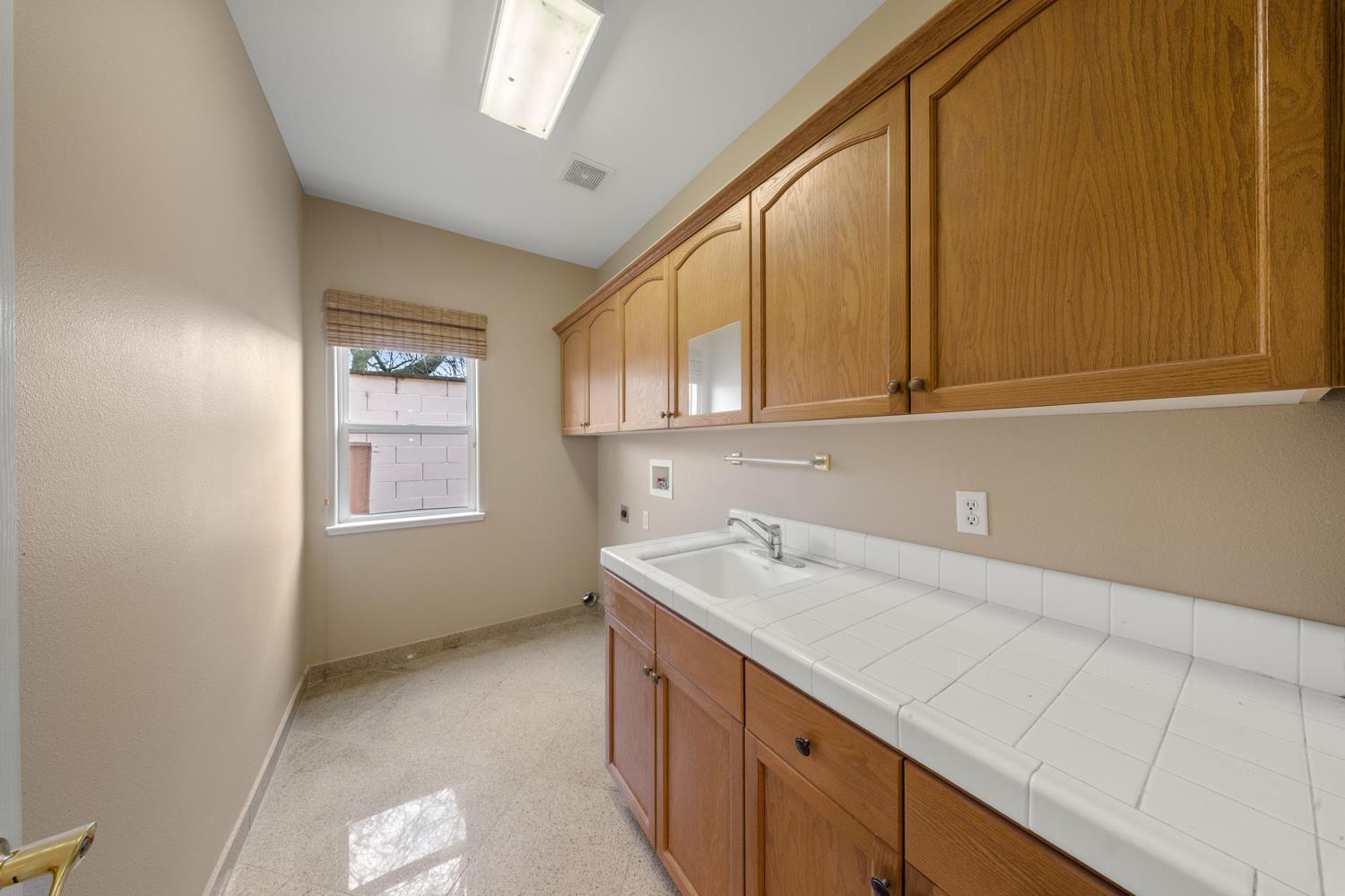 4601 Vía Altura Modesto, CA 95357 - Photo 17 of 30 a view of a kitchen with wooden floor and cabinets