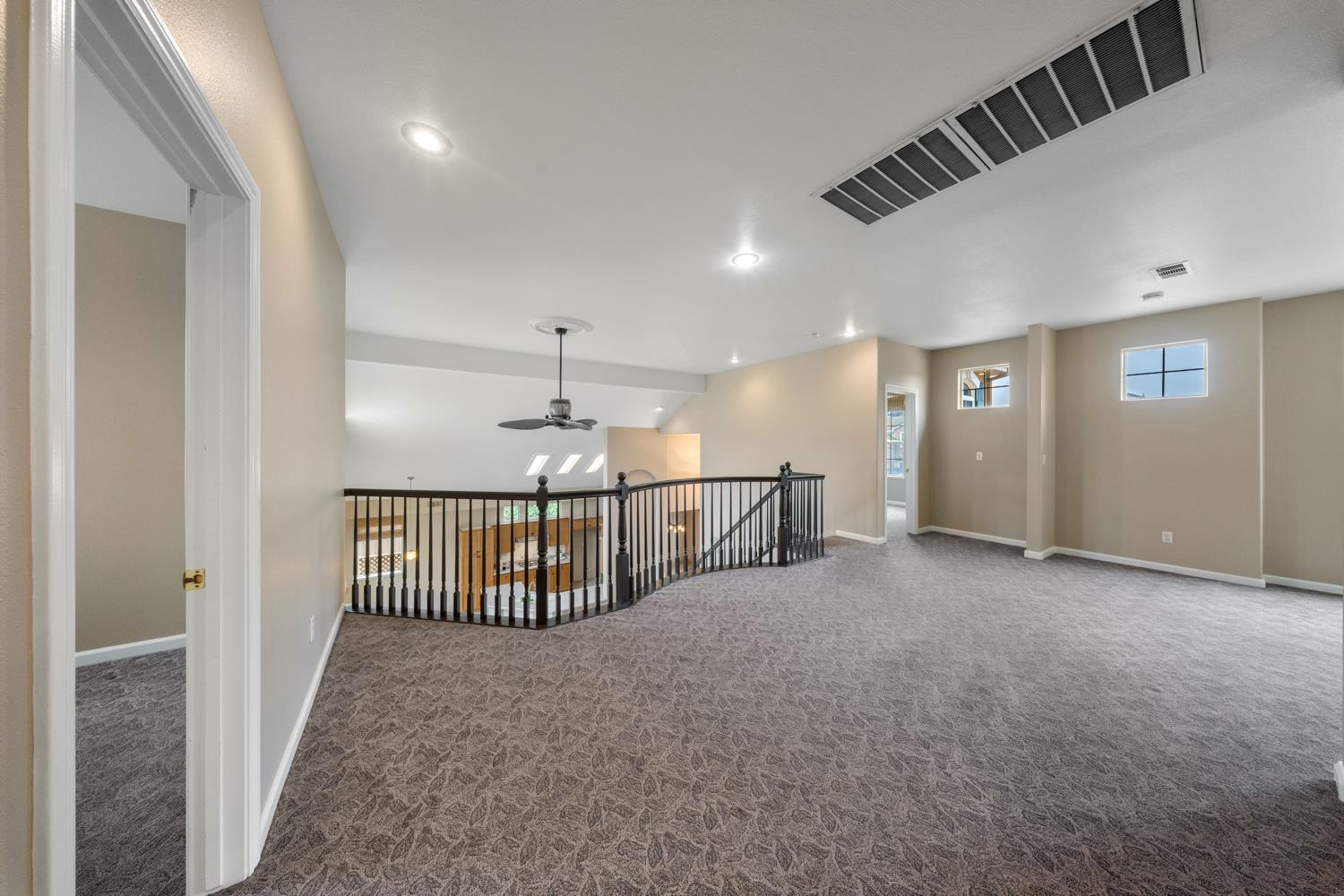 4601 Vía Altura Modesto, CA 95357 - Photo 22 of 30 a view of a livingroom with a staircase