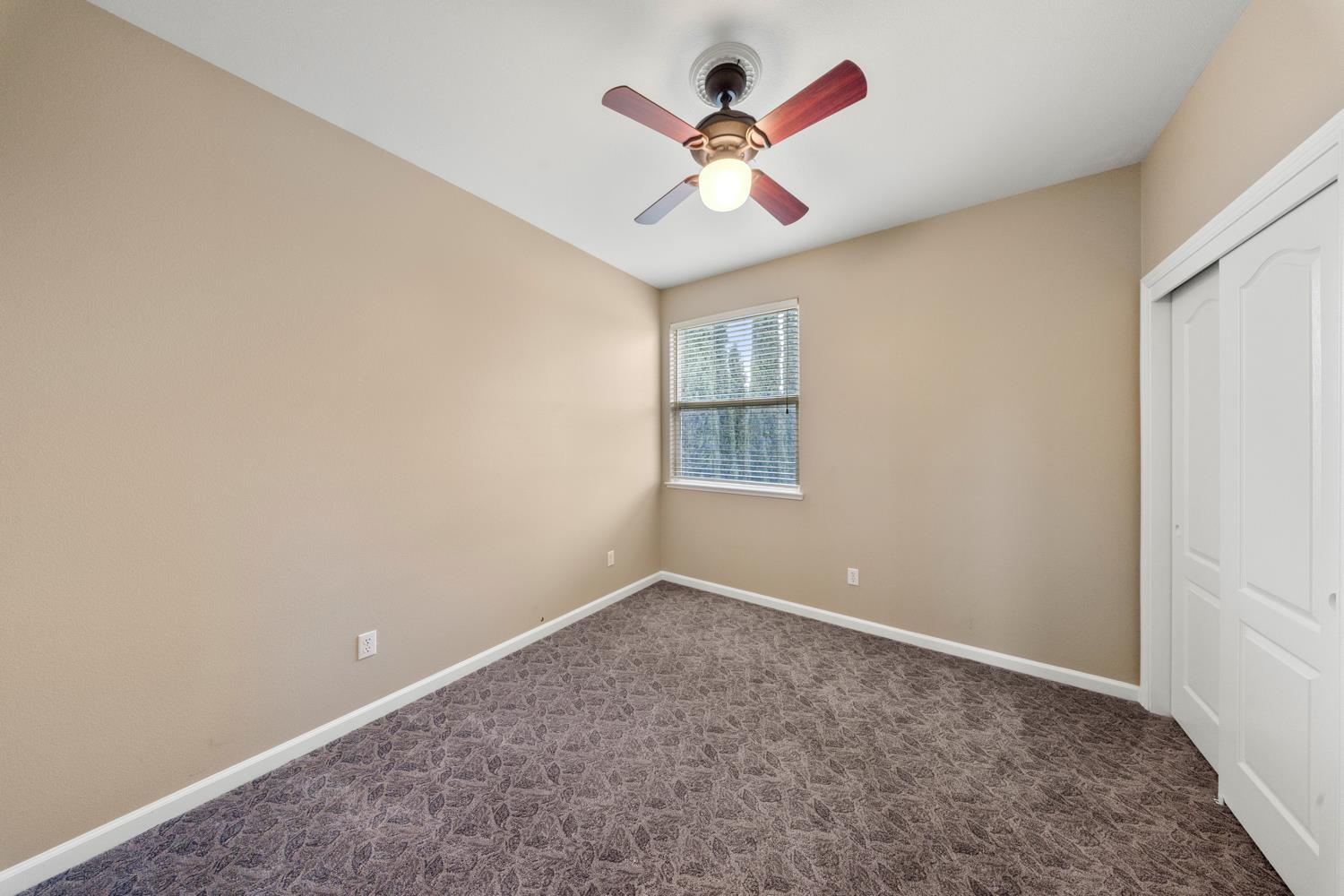 4601 Vía Altura Modesto, CA 95357 - Photo 24 of 30 an empty room with a window and a fan