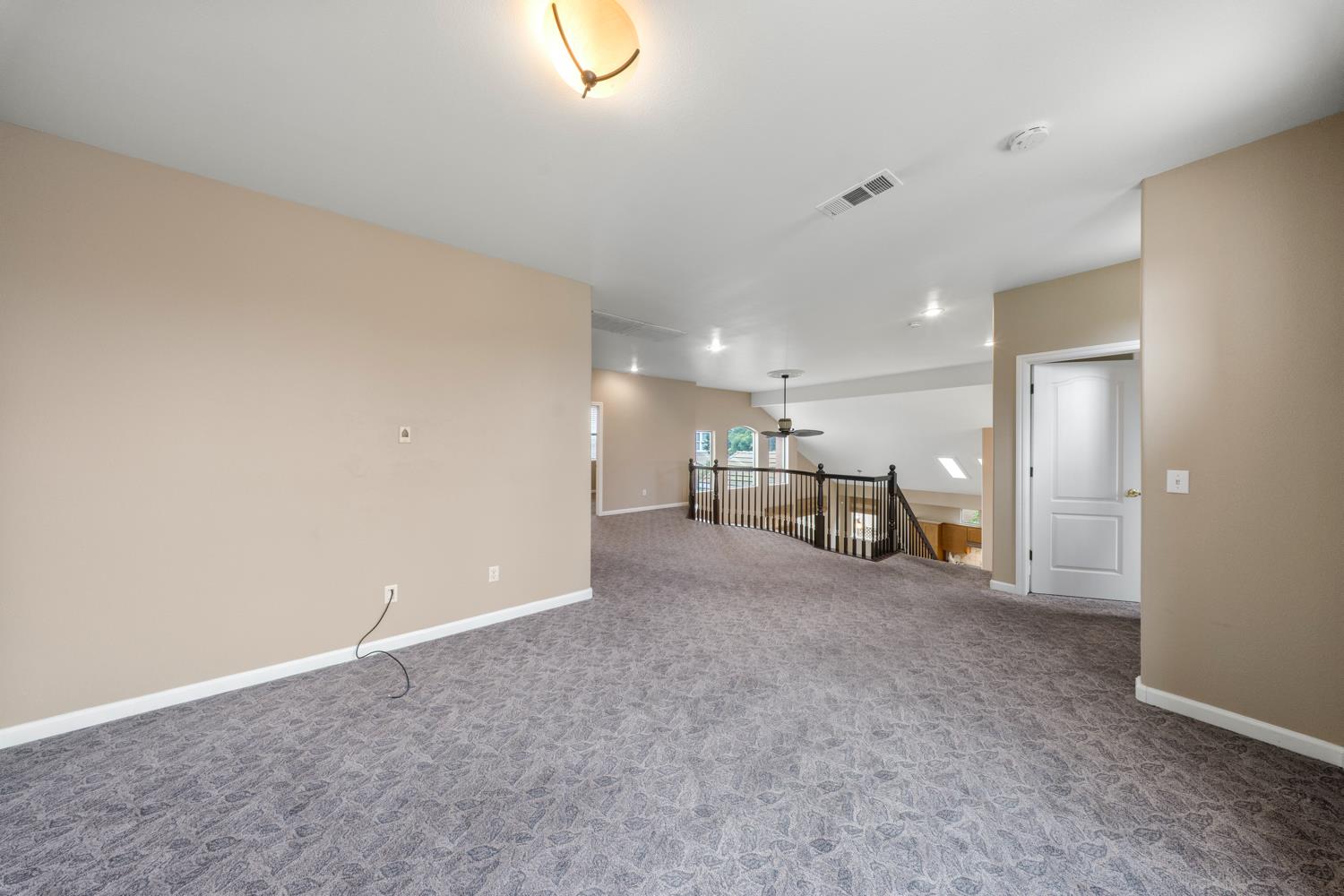 4601 Vía Altura Modesto, CA 95357 - Photo 25 of 30 a view of a livingroom with a staircase