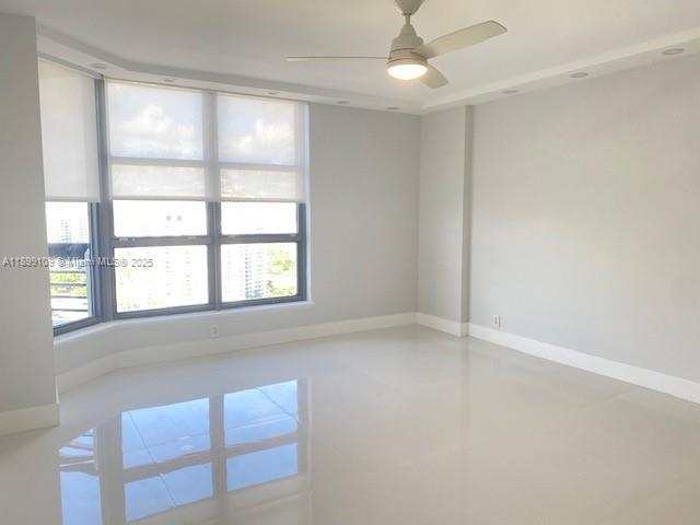 3530 Mystic Pointe Drive, Unit 2503 Aventura, FL 33180 - Photo 2 of 24 a view of an empty room with a window