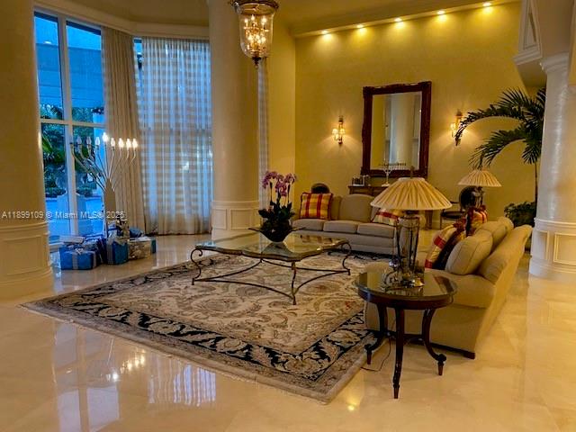 3530 Mystic Pointe Drive, Unit 2503 Aventura, FL 33180 - Photo 23 of 24 a living room with fireplace furniture and a window