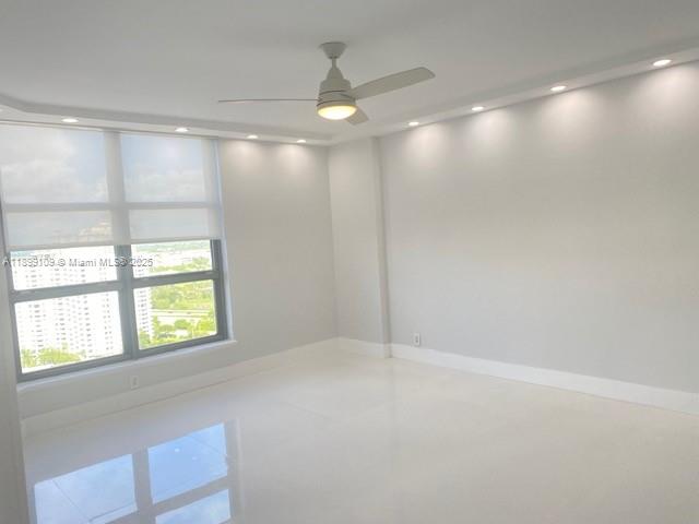 3530 Mystic Pointe Drive, Unit 2503 Aventura, FL 33180 - Photo 6 of 24 a view of an empty room with a window