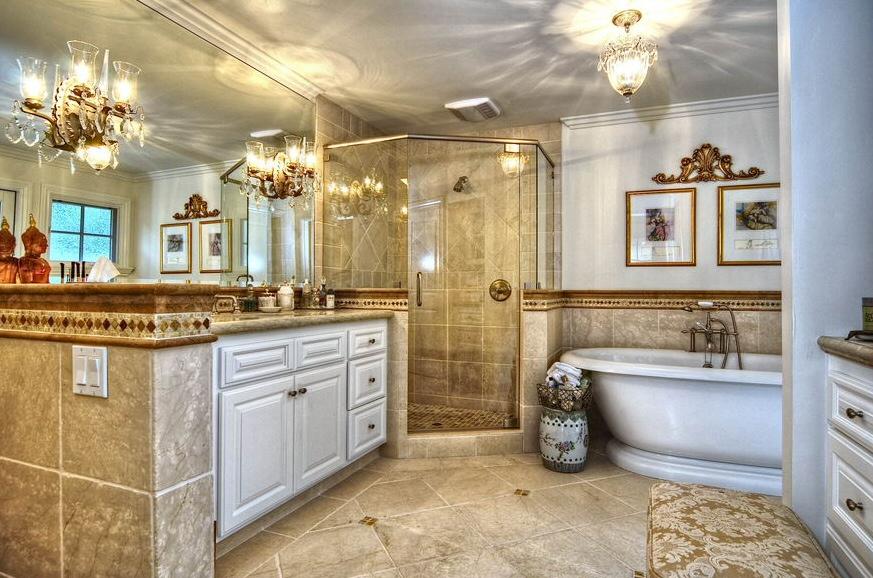 908 El Rancho Road Santa Barbara, CA 93108 - Photo 7 of 9 a spacious bathroom with a sink mirror and a bathtub
