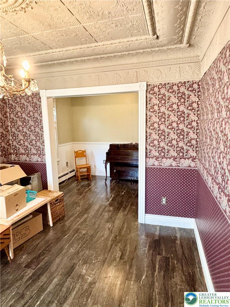 7241 Decatur Street New Tripoli, PA 18066 - Photo 11 of 36 Ornate ceiling moldings and patterned walls adorn this charming interior space.