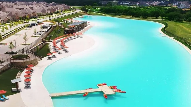 a view of a swimming pool with a yard