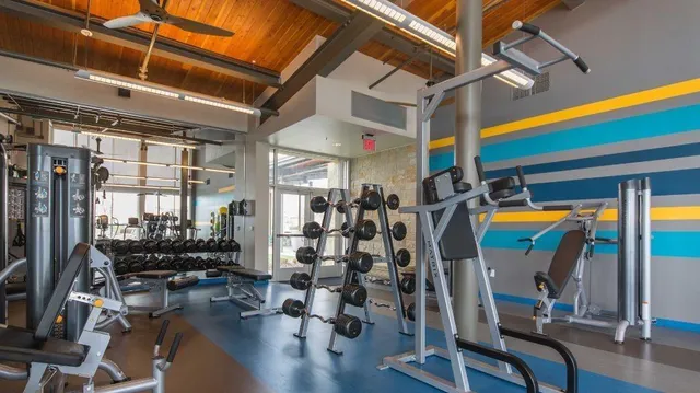 a room with lots of gym equipment